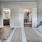 a bedroom with a bed and a mirror and closet access